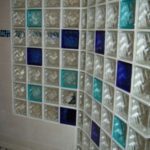 A wall of glass blocks with different colors.