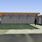 A person standing in front of a building.