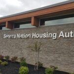 Exterior view of the seneca nation housing authority building with signage.