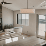 Modern living room with a fireplace, contemporary furnishings, and large windows providing ample natural light.
