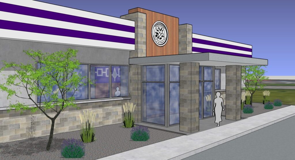Modern commercial building exterior with landscaping.