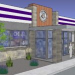 Modern commercial building exterior with landscaping.